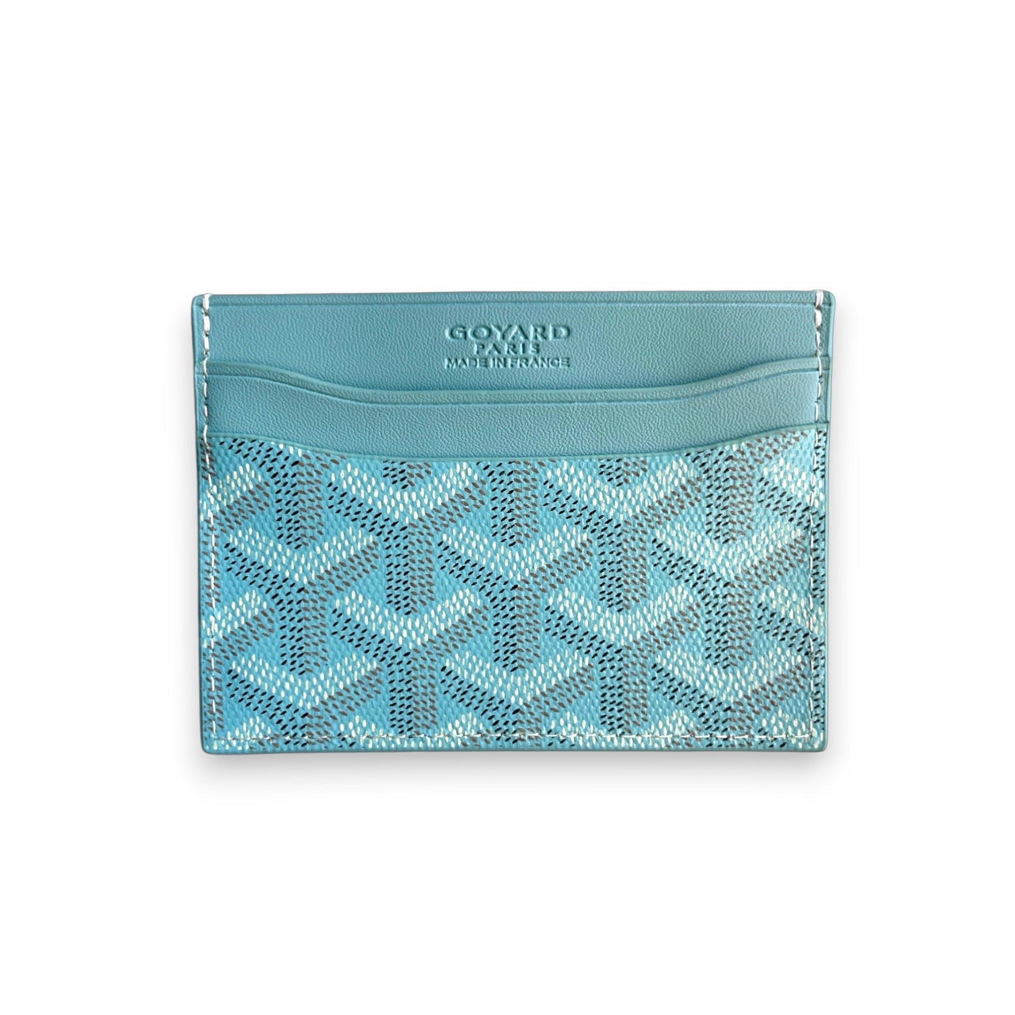 Baby blue Goyard card holder with iconic pattern, showcasing sleek design and compact size for easy carrying.