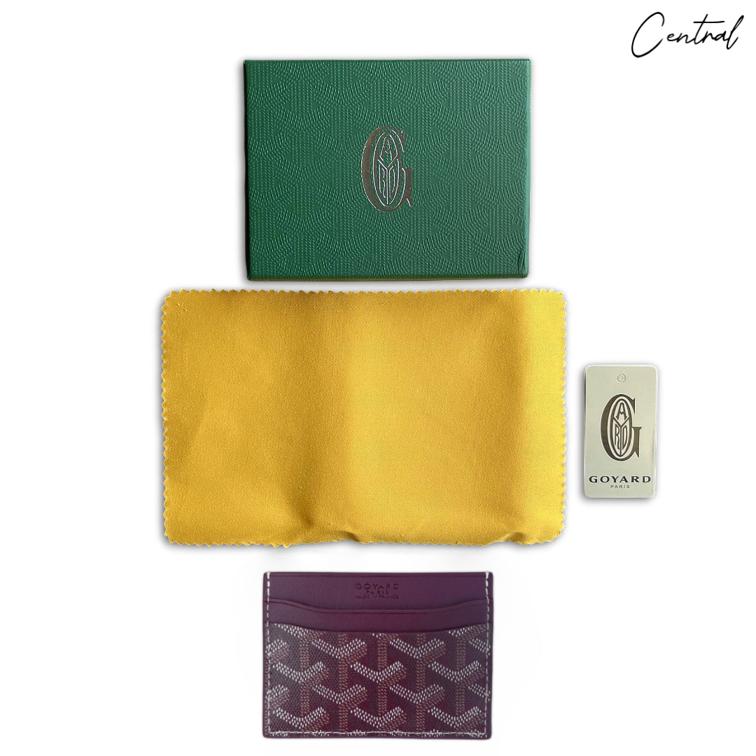 Burgundy Goyard card holder with signature pattern and sleek design, featuring multiple card slots and a compact shape.