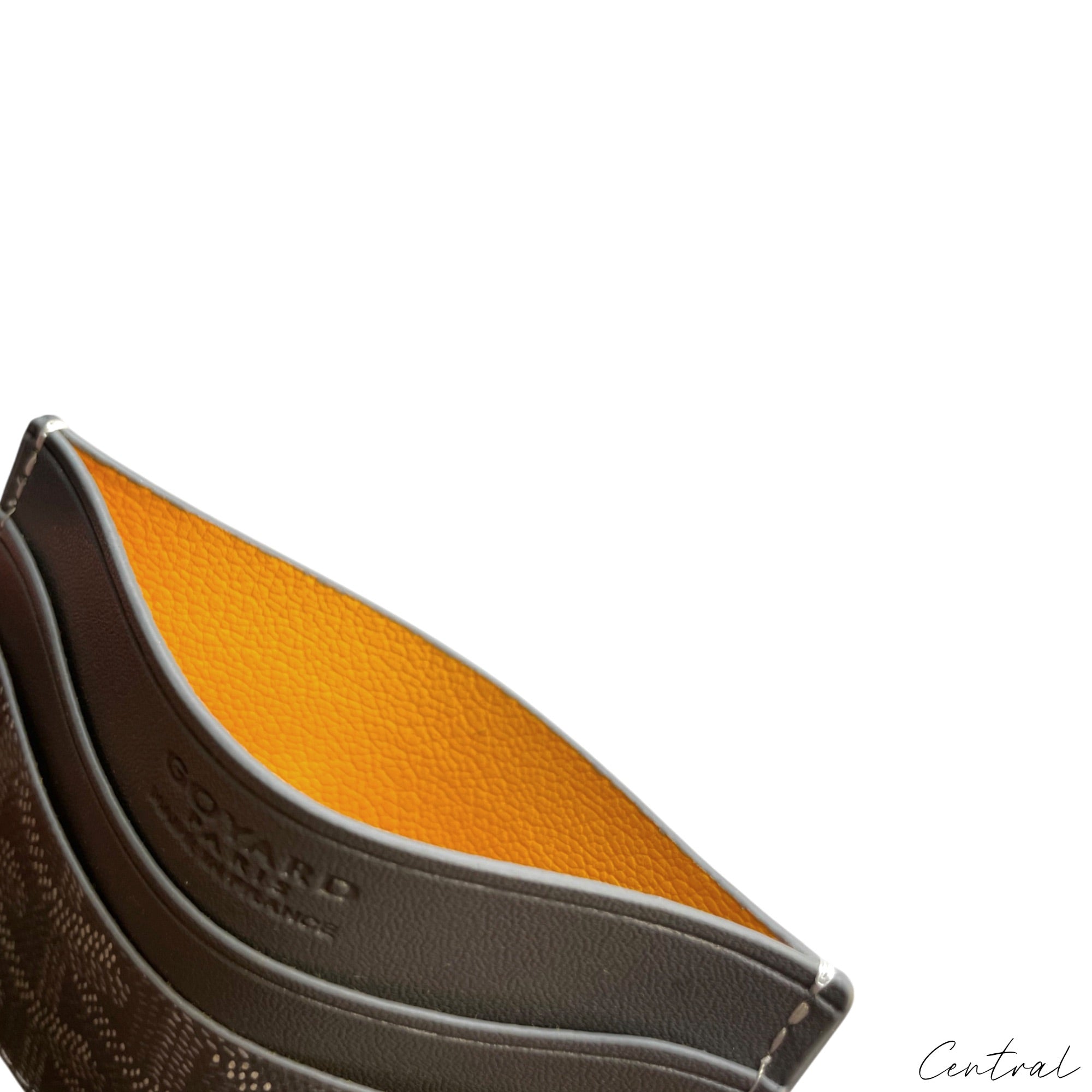 Gray Goyard card holder from Central ae featuring a sleek design and classic logo pattern, perfect for organizing cards.