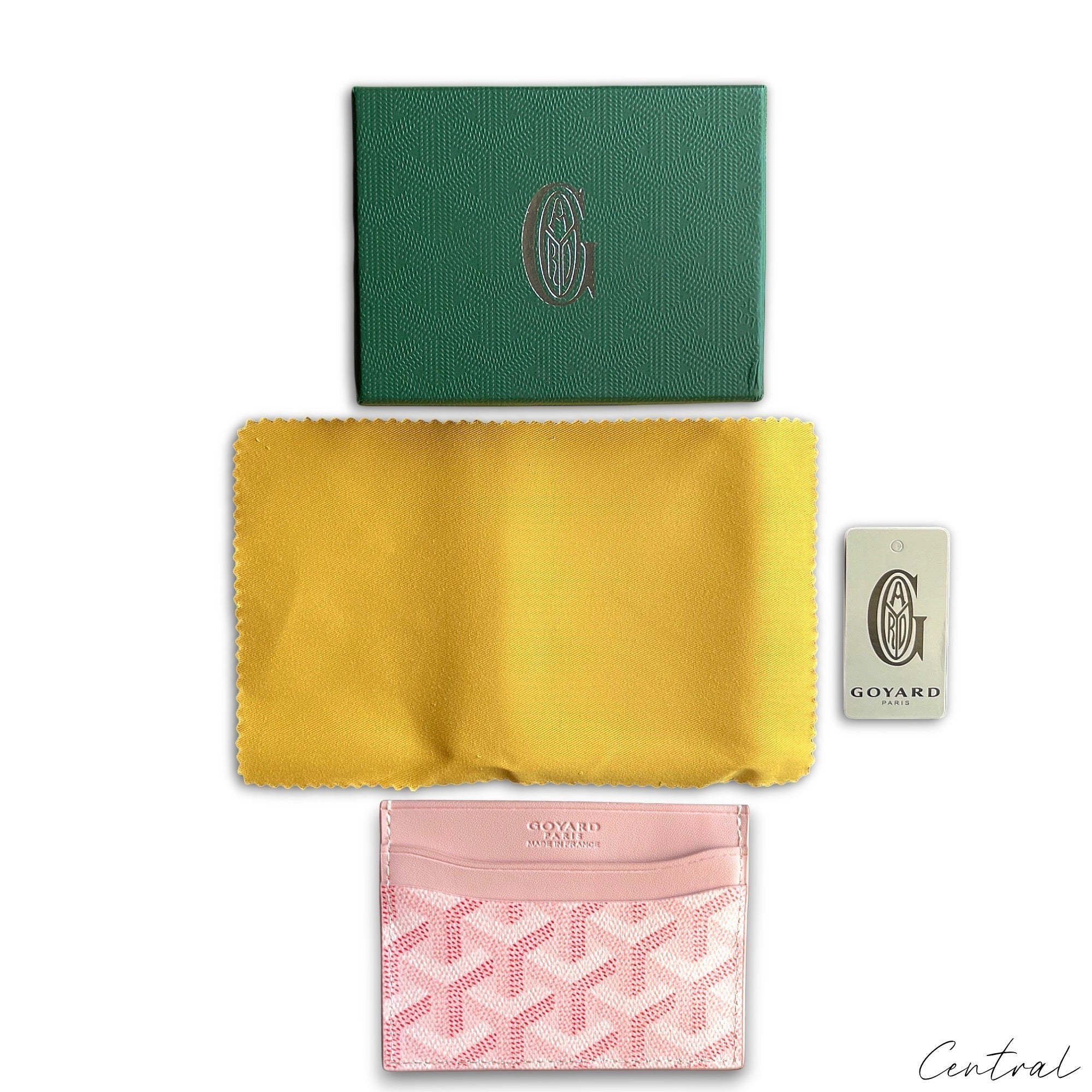 Pink Goyard card holder featuring a classic pattern, showcasing its sleek design and premium craftsmanship.