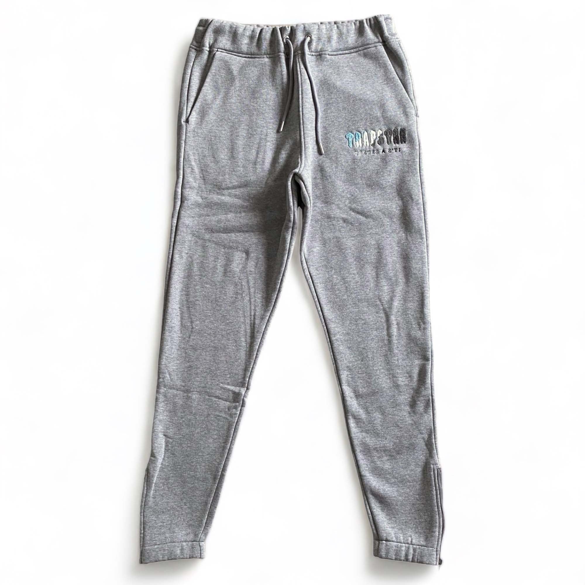 Trapstar Chenille Decoded tracksuit in grey, featuring a hoodie and pants set, displayed on a neutral background.