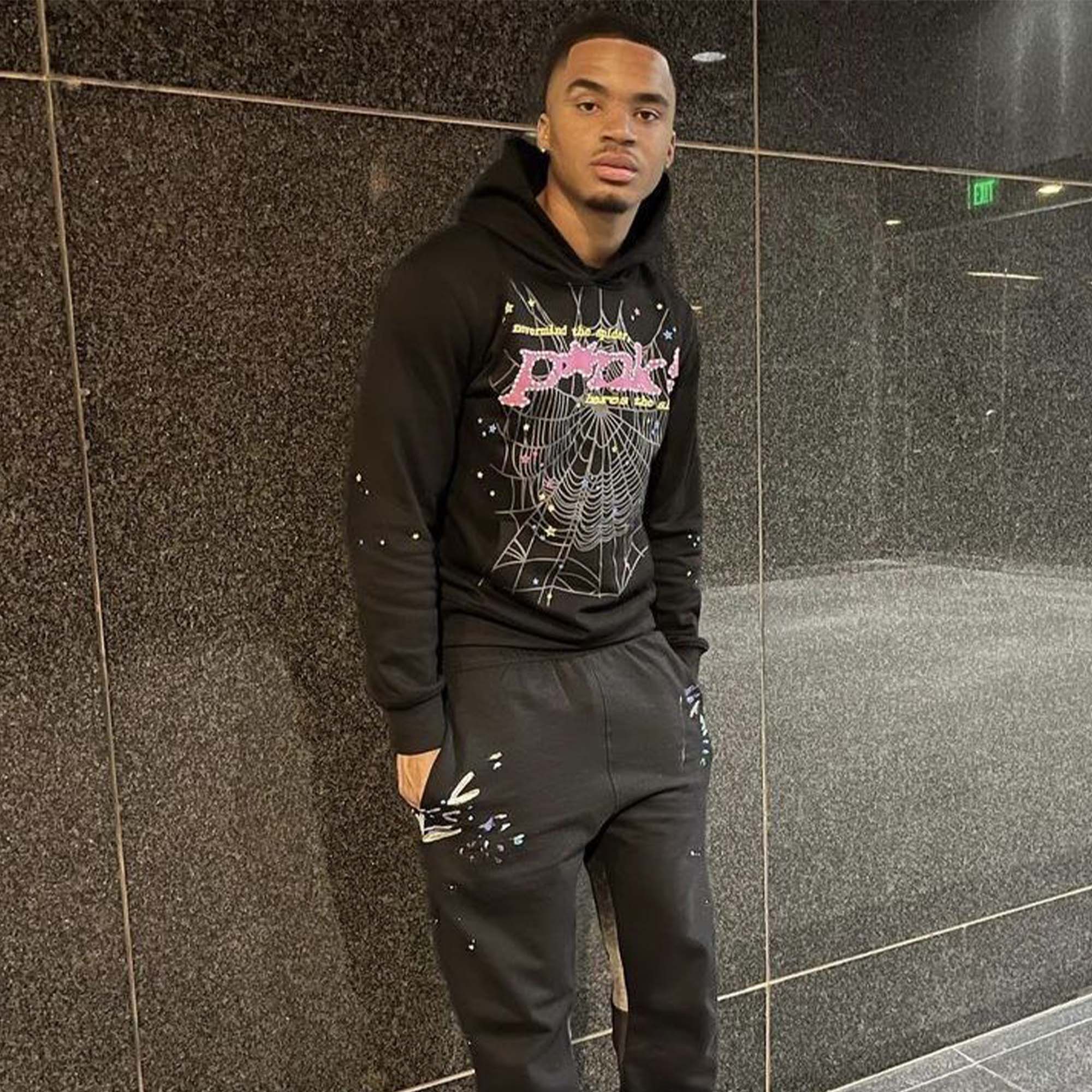 Sp5der black hoodie with pink logo design from Central ae, featuring a comfortable fit and stylish look.
