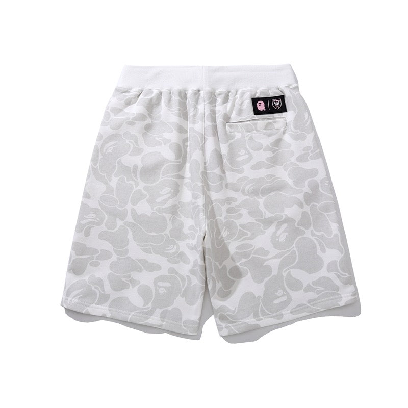 BAPE x Inter Miami camo shorts in white featuring a stylish design by Central ae, displayed on a neutral background.