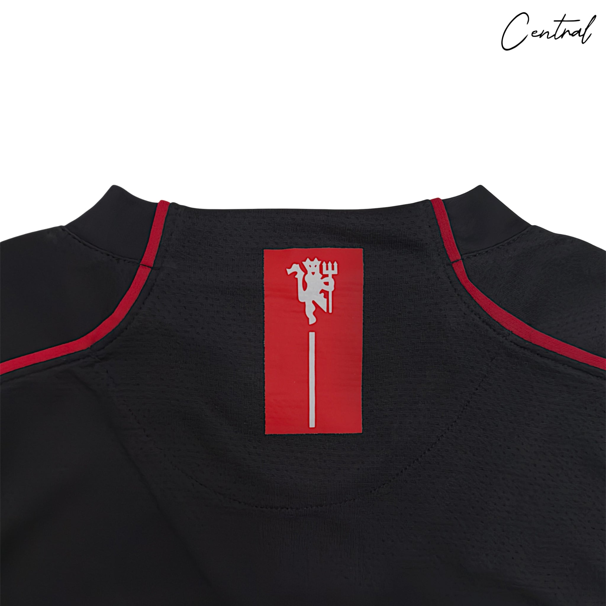 2007-08 Manchester United long-sleeve away shirt by Central Ae in vibrant away colors with team crest.