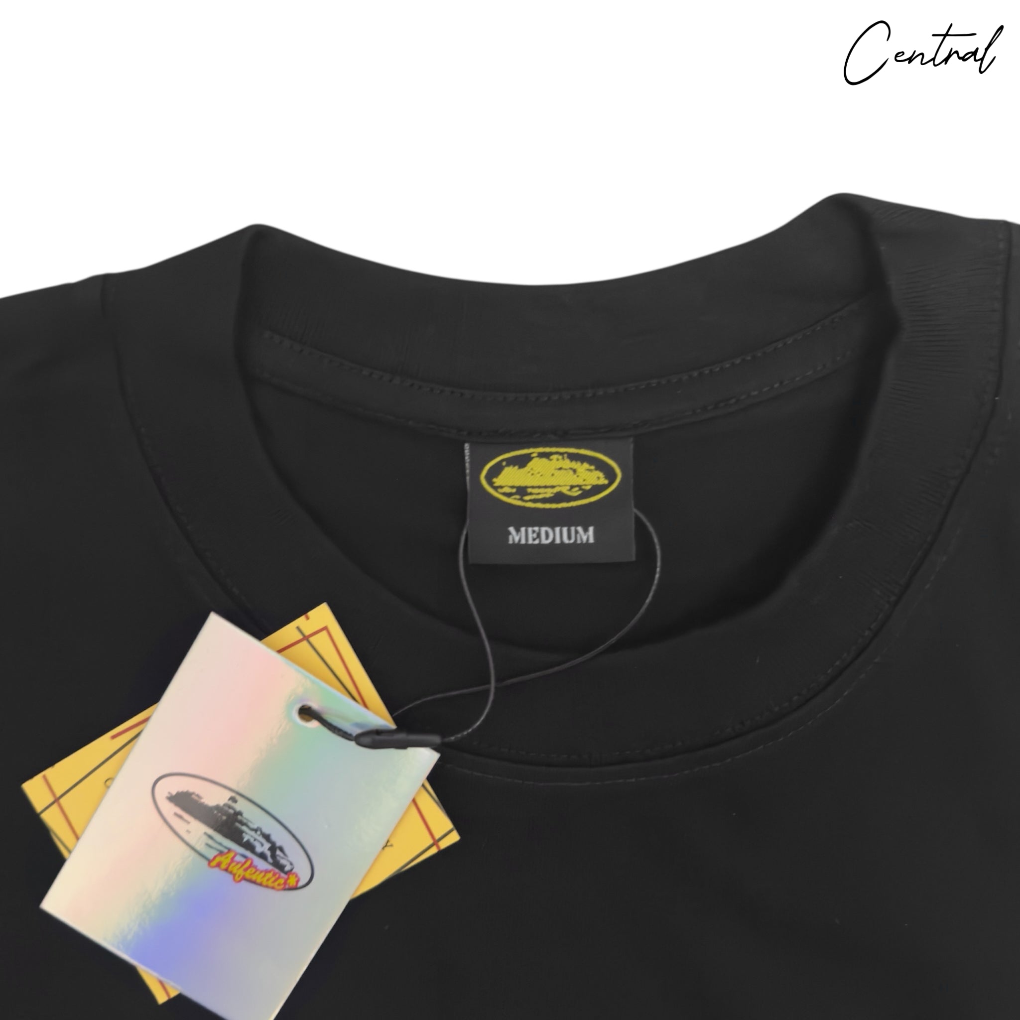 Central Ae Corteiz OG Alcatraz T-shirt featuring a graphic design on a black fabric background.