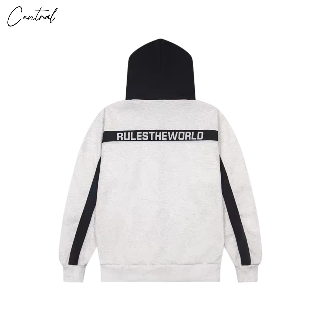 Central Ae Corteiz Ribbed Sporteiz Zip Hoodie in gray, featuring a zip closure and ribbed texture, displayed on a hanger.