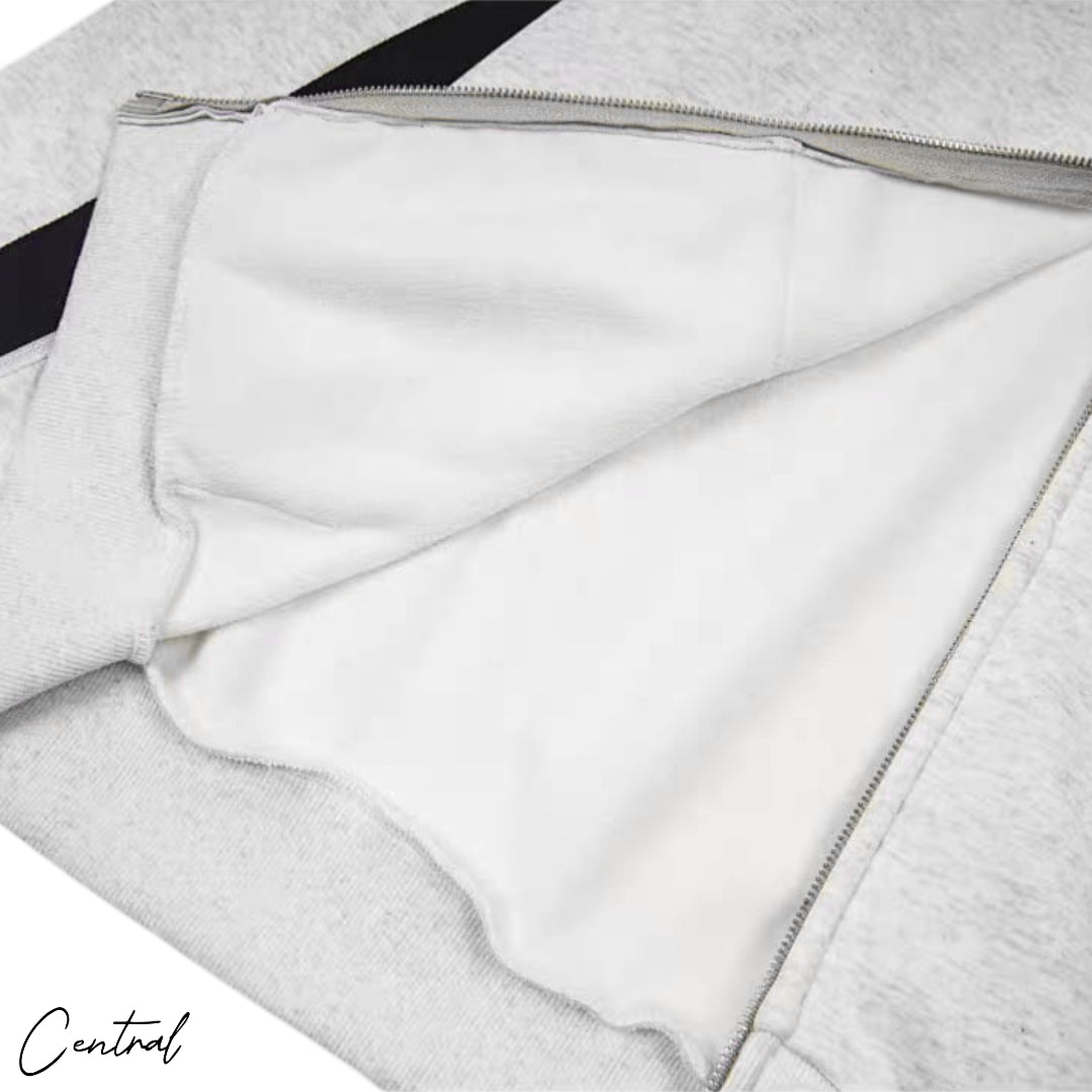 Corteiz Ribbed Sporteiz Zip Hoodie in black, featuring a full zip front and ribbed texture, displayed on a hanger.