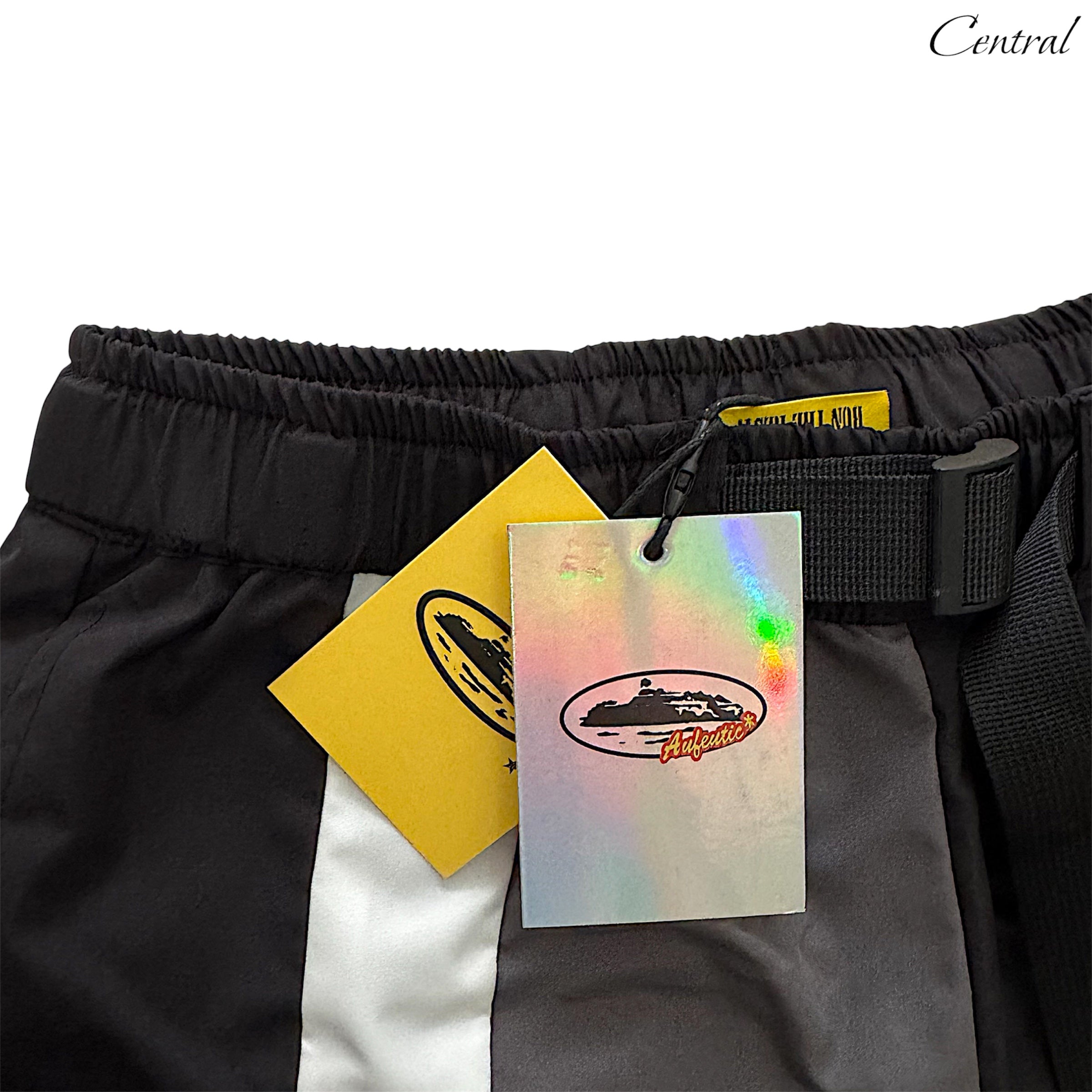 Black Corteiz shorts displayed on a hanger, showcasing a casual style and lightweight fabric for everyday wear.