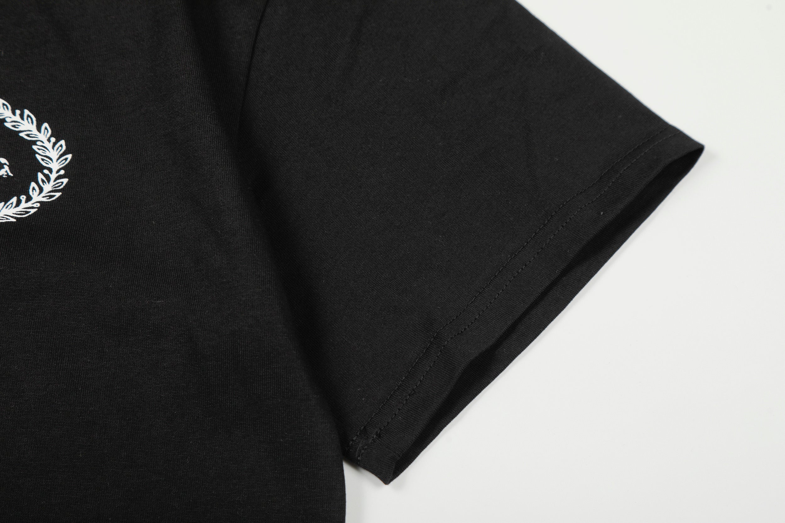 Corteiz x BBK Royale Tee by Central Ae in black, featuring logo print and relaxed fit design.