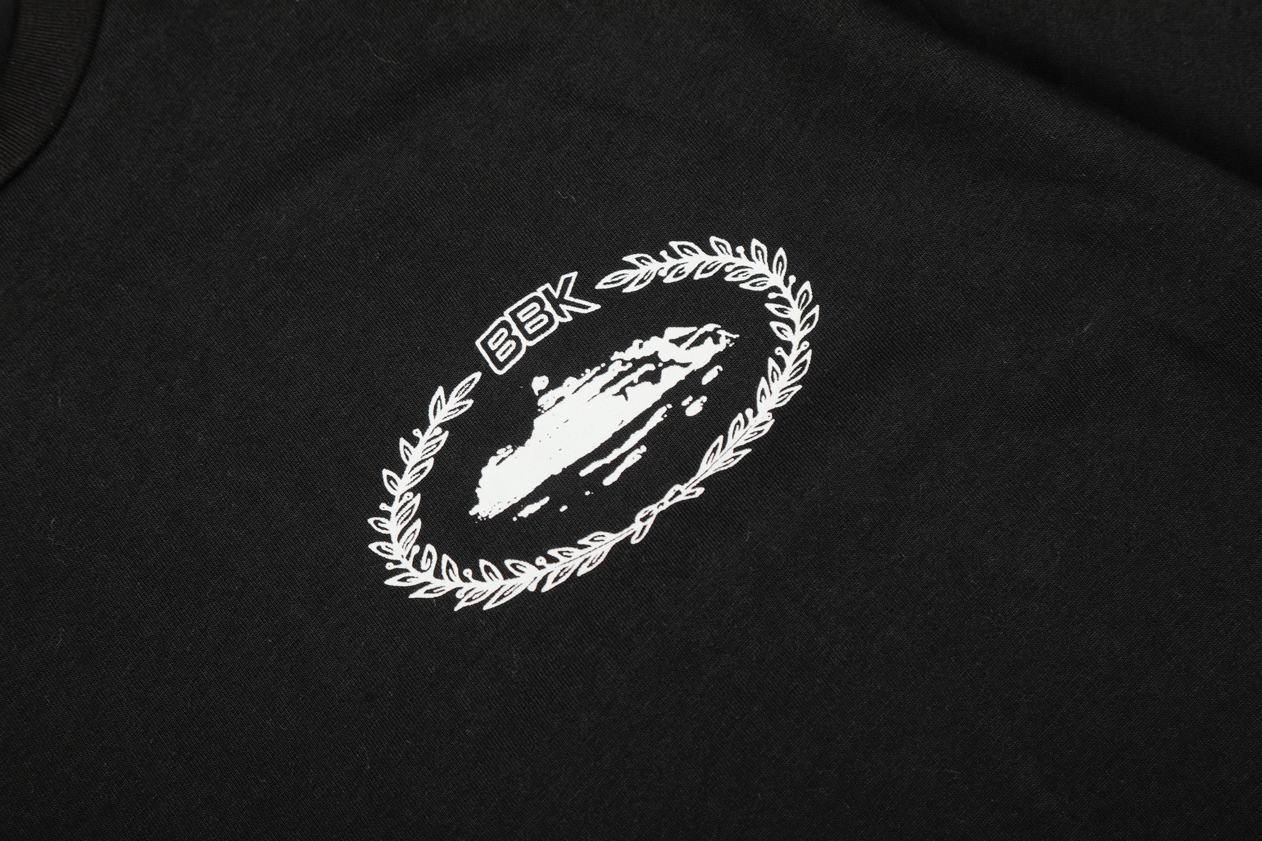 Corteiz x BBK Royale Tee in black featuring logo print on the front, made by Central Ae, displayed on a white background.