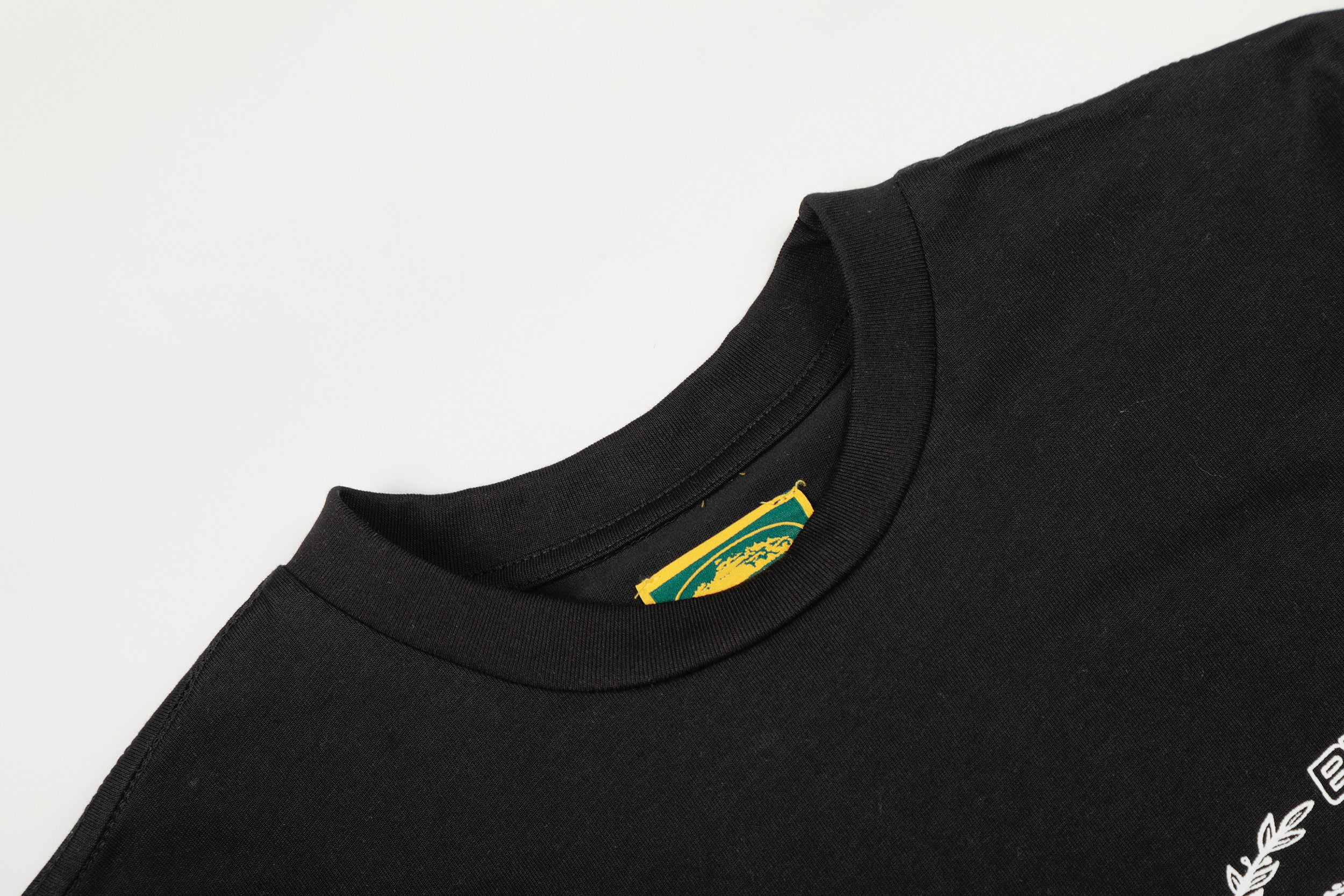 Corteiz x BBK Royale Tee in black featuring a bold logo design from Central Ae, laid flat for display.