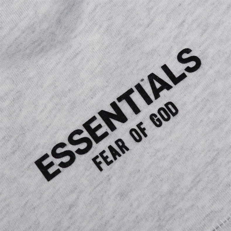 Light grey Essential Shorts by CENTRAL AE displayed on a model, showcasing casual fit and comfortable fabric.