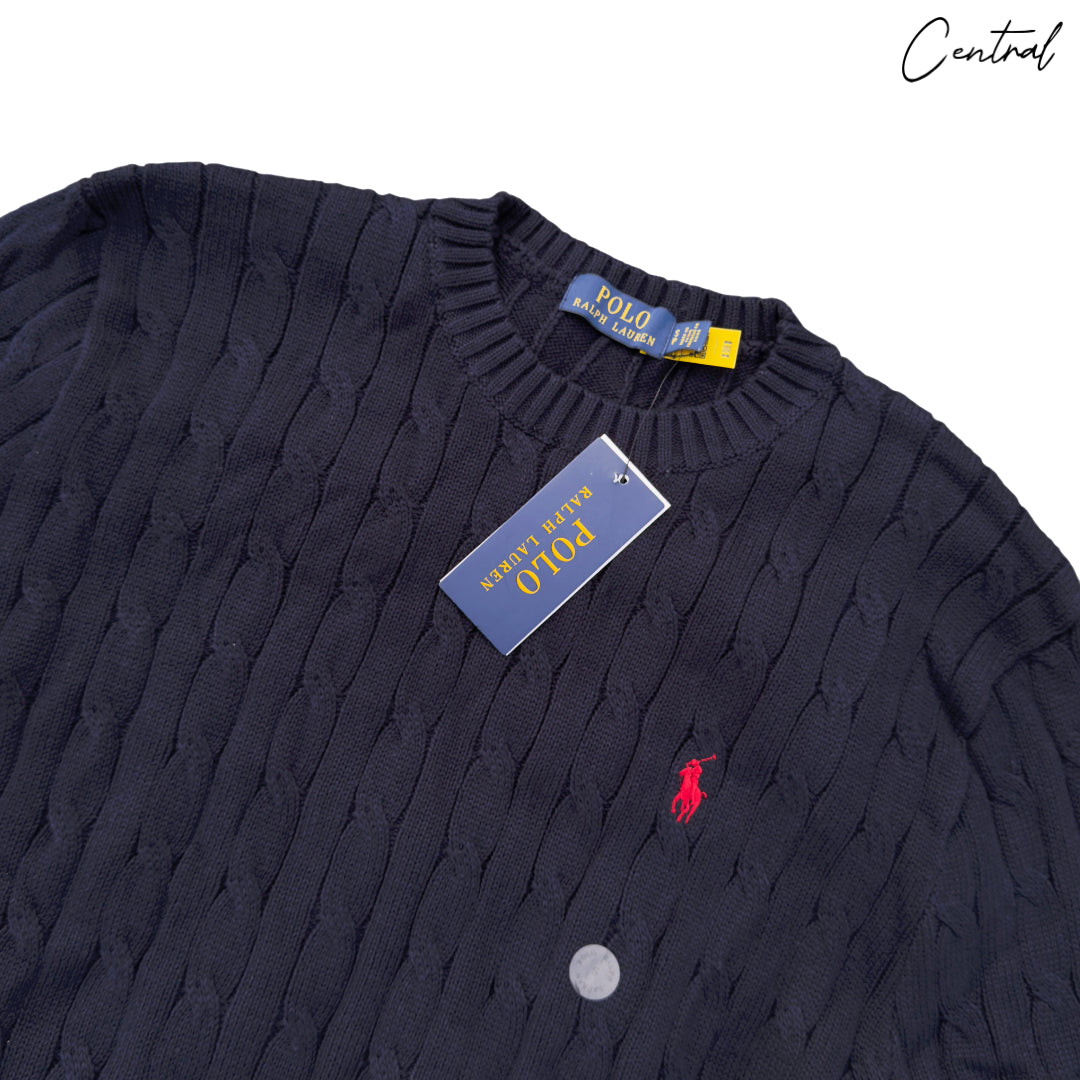 Navy cable-knit cotton jumper by Polo Ralph Lauren, showcasing textured fabric and classic crew neckline.