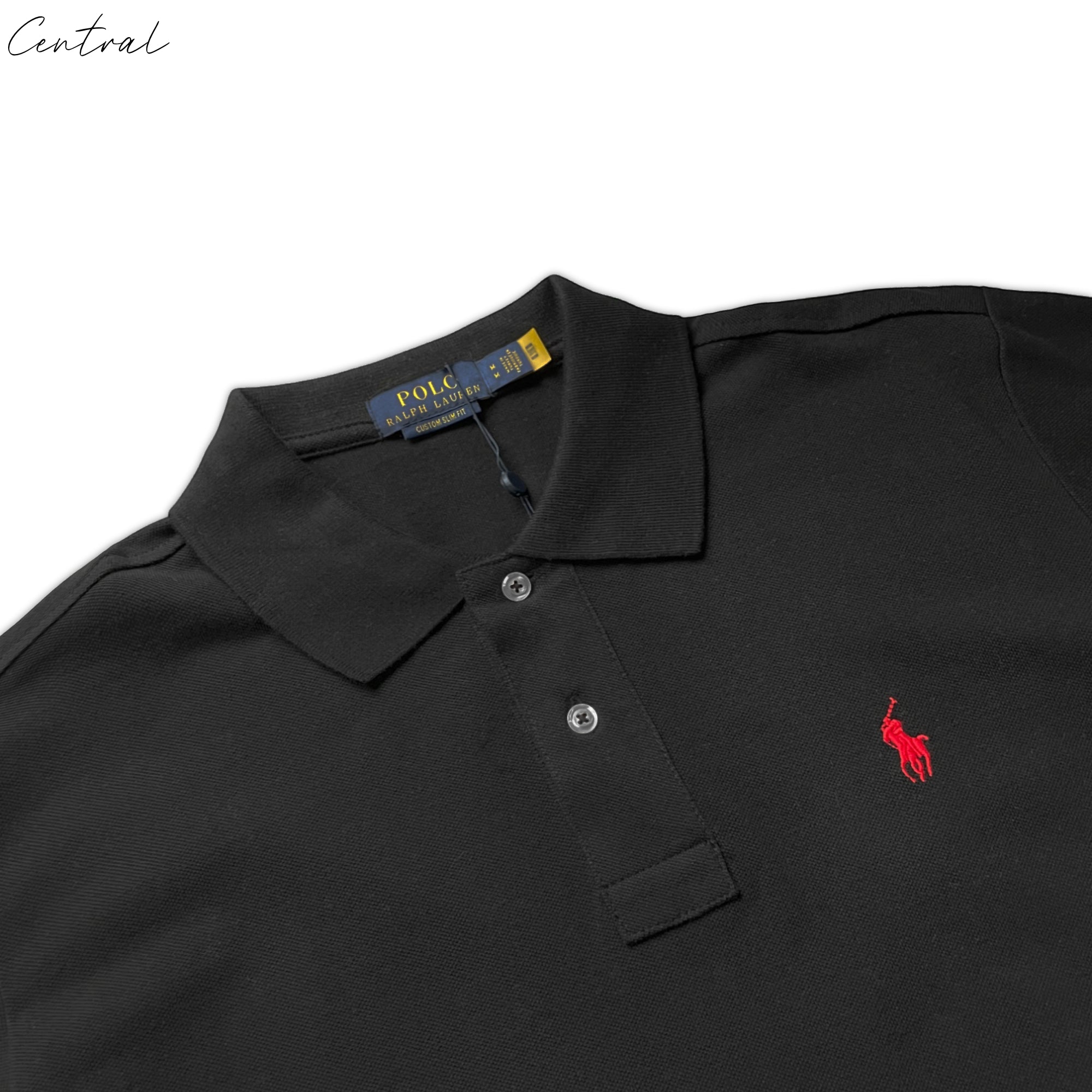 Ralph Lauren Polo shirt in black, featuring a classic design and embroidered logo, displayed on a wooden hanger.