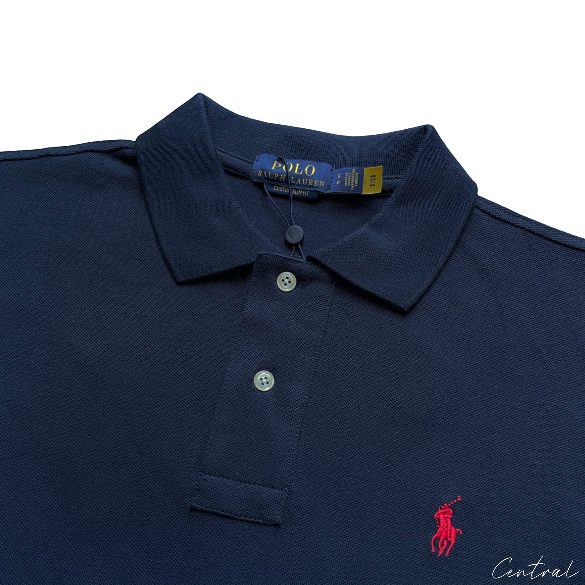 Ralph Lauren Navy Polo shirt displayed on a hanger, featuring the iconic logo and classic fit design.