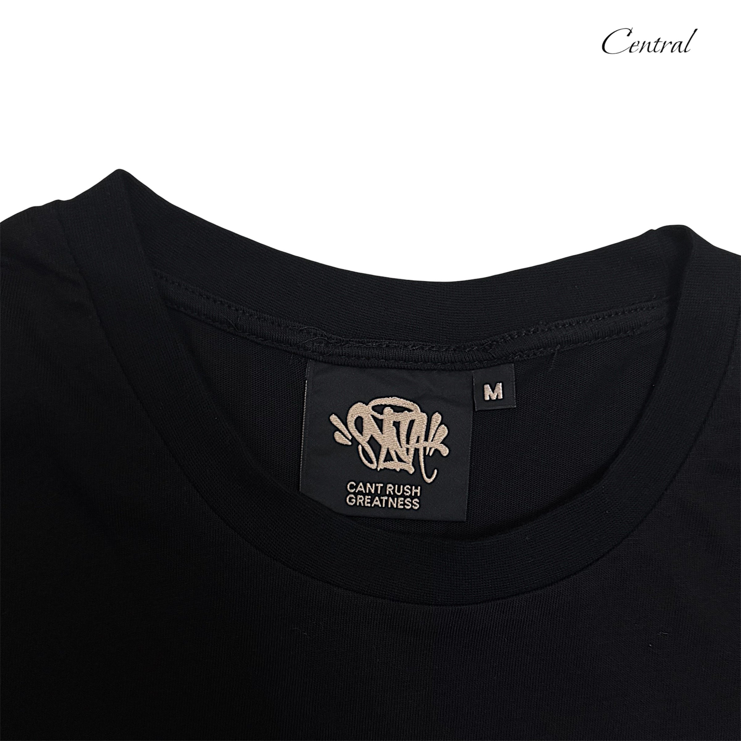 Black and rose gold Syna T-shirt and shorts set displayed on a neutral background.