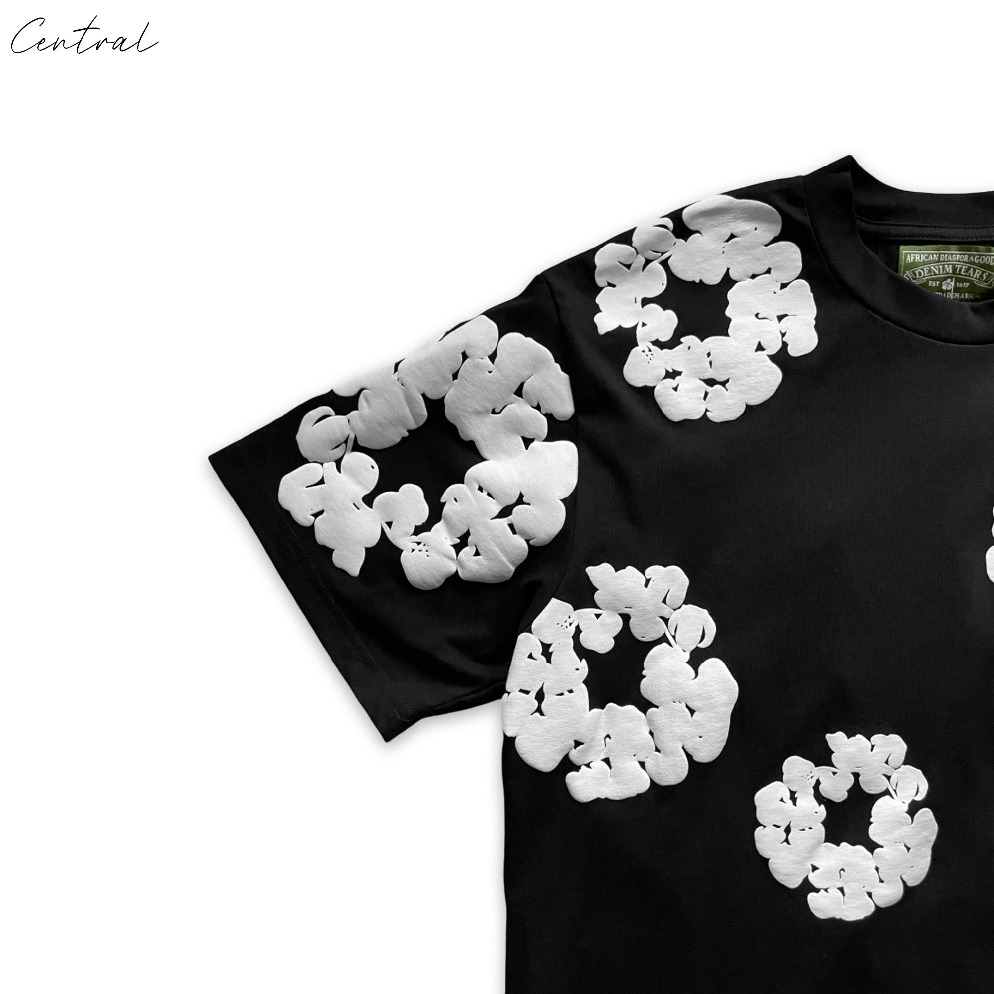 DENIM TEARS t-shirt by Central ae featuring a unique graphic design on a classic fit shirt.