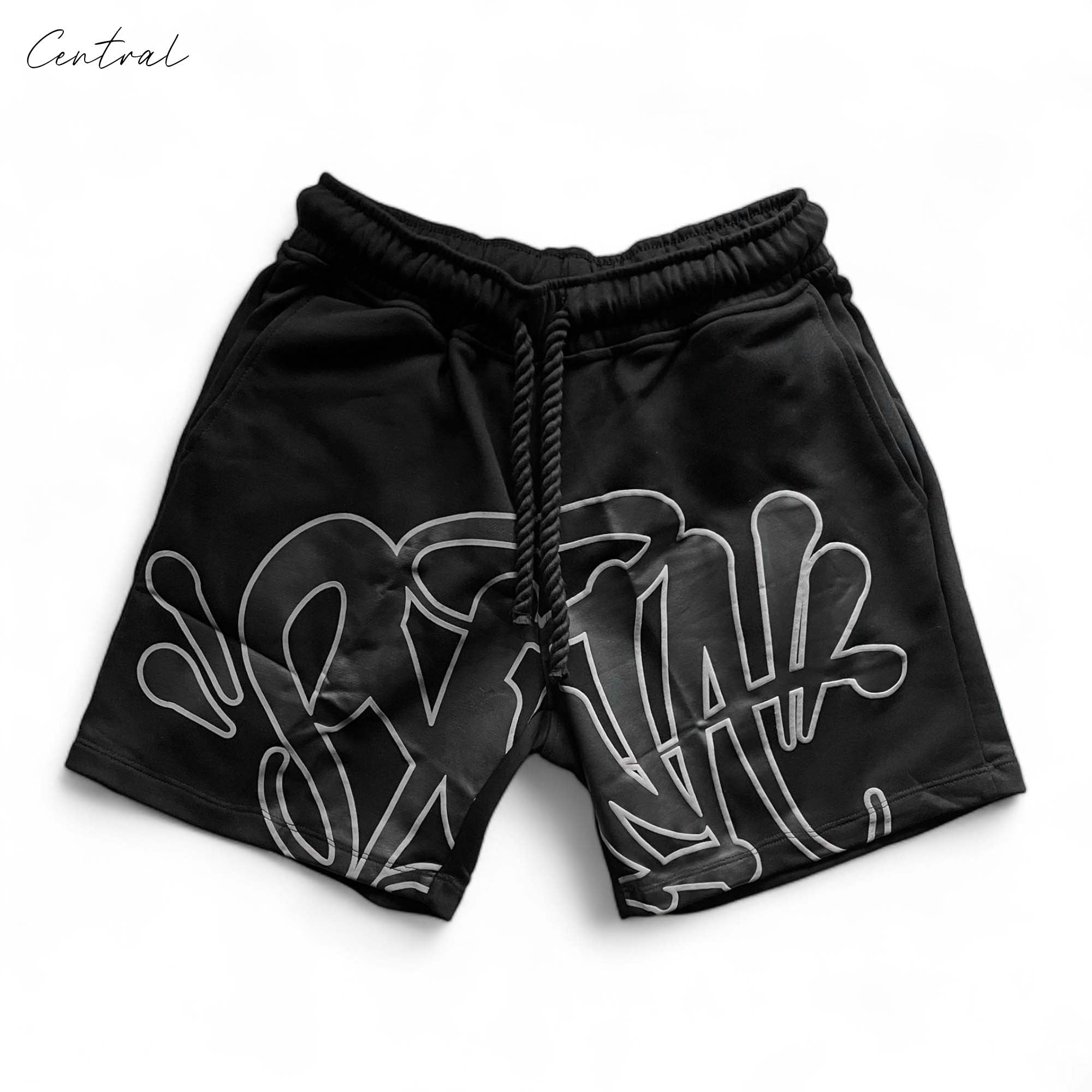 Black Syna World short set featuring a t-shirt and shorts by Central ae, laid out on a neutral background.