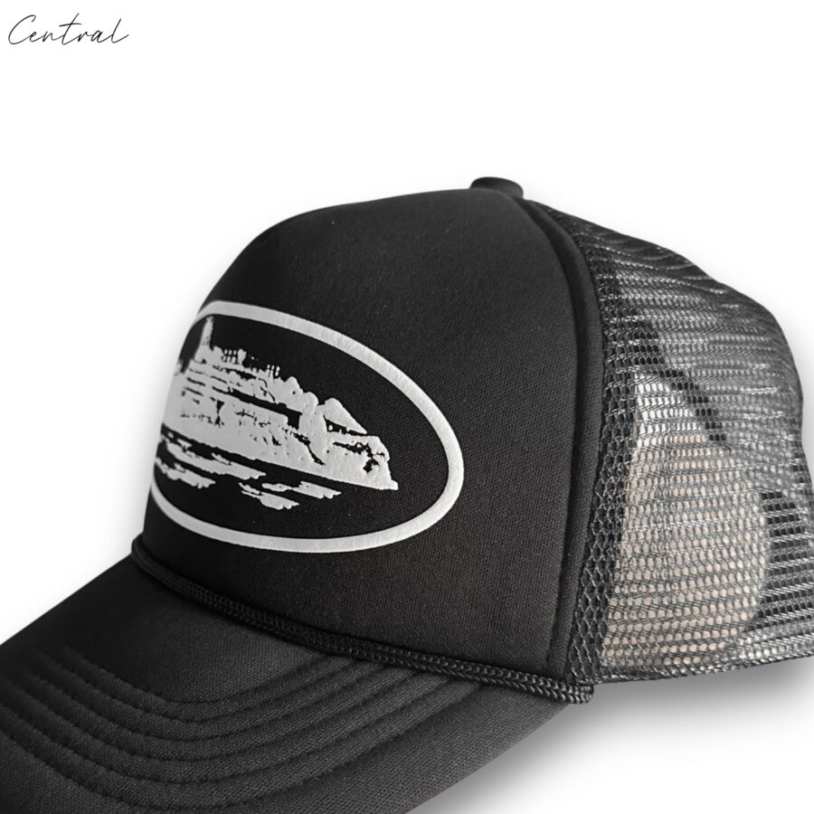 Black Corteiz cap by Central ae displayed with a curved brim and adjustable strap, showcasing a sleek, modern design.