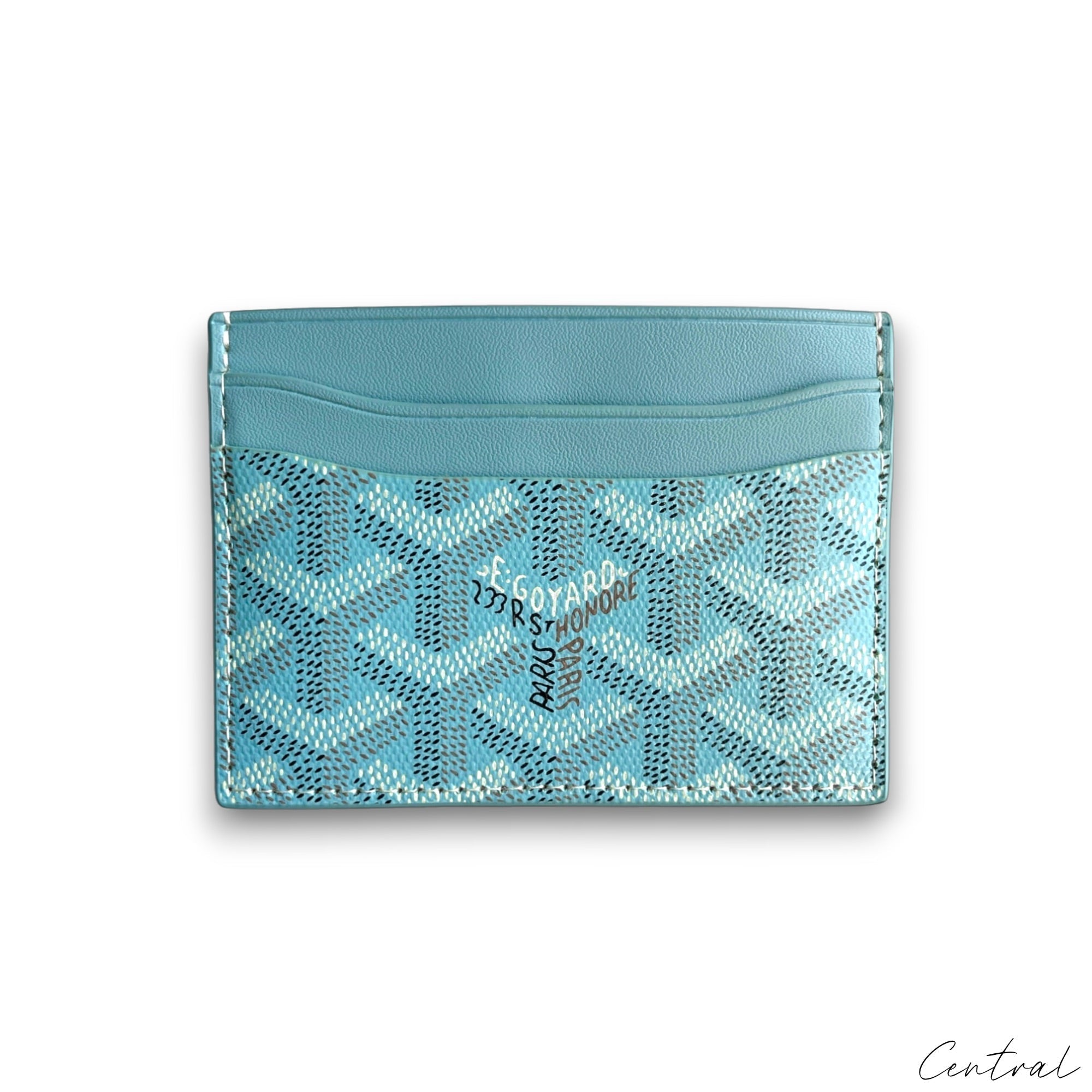 Baby blue Goyard card holder featuring a sleek design and signature pattern, showcasing its elegant craftsmanship.