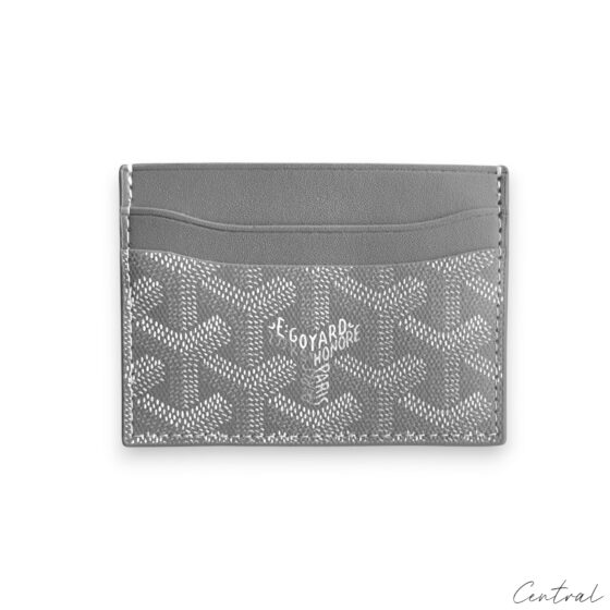 Gray Goyard card holder featuring a sleek design and signature pattern, perfect for organizing cards.