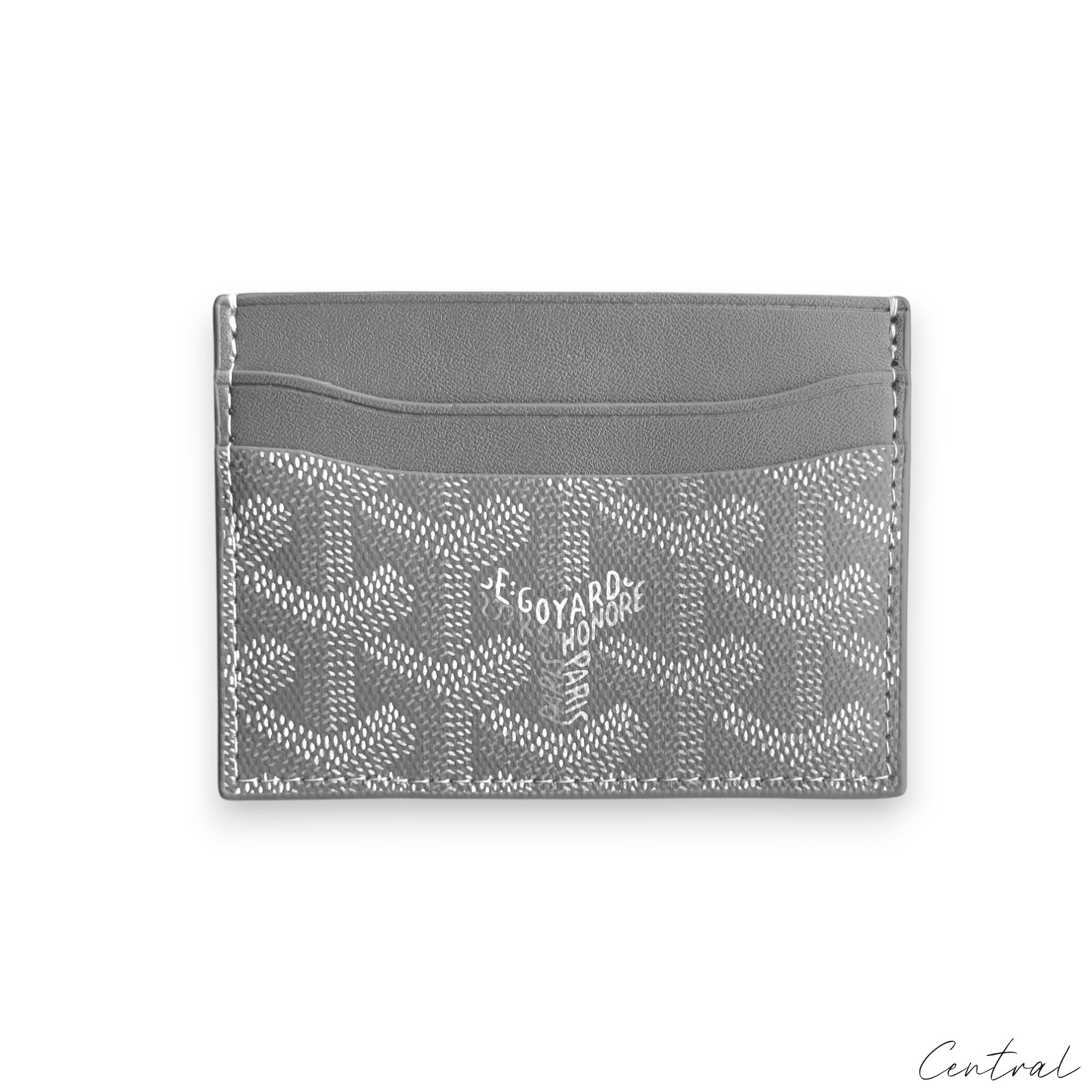 Gray Goyard card holder featuring a sleek design and signature pattern, perfect for organizing cards.