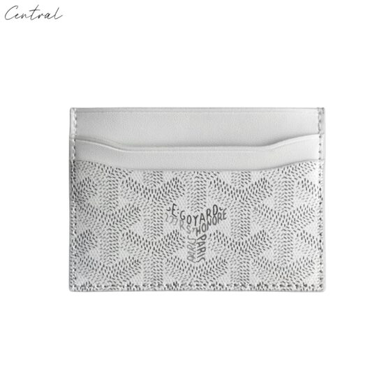 White Goyard card holder featuring signature pattern and sleek design by Central ae, displayed on a neutral background.