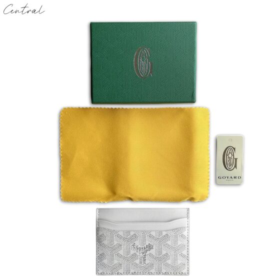 White Goyard card holder by Central ae featuring the iconic pattern and sleek design, displayed on a neutral background.