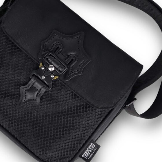 Trapstar Black Edition Irongate T Cross-Body Bag by Central ae, featuring sleek black design and adjustable strap.