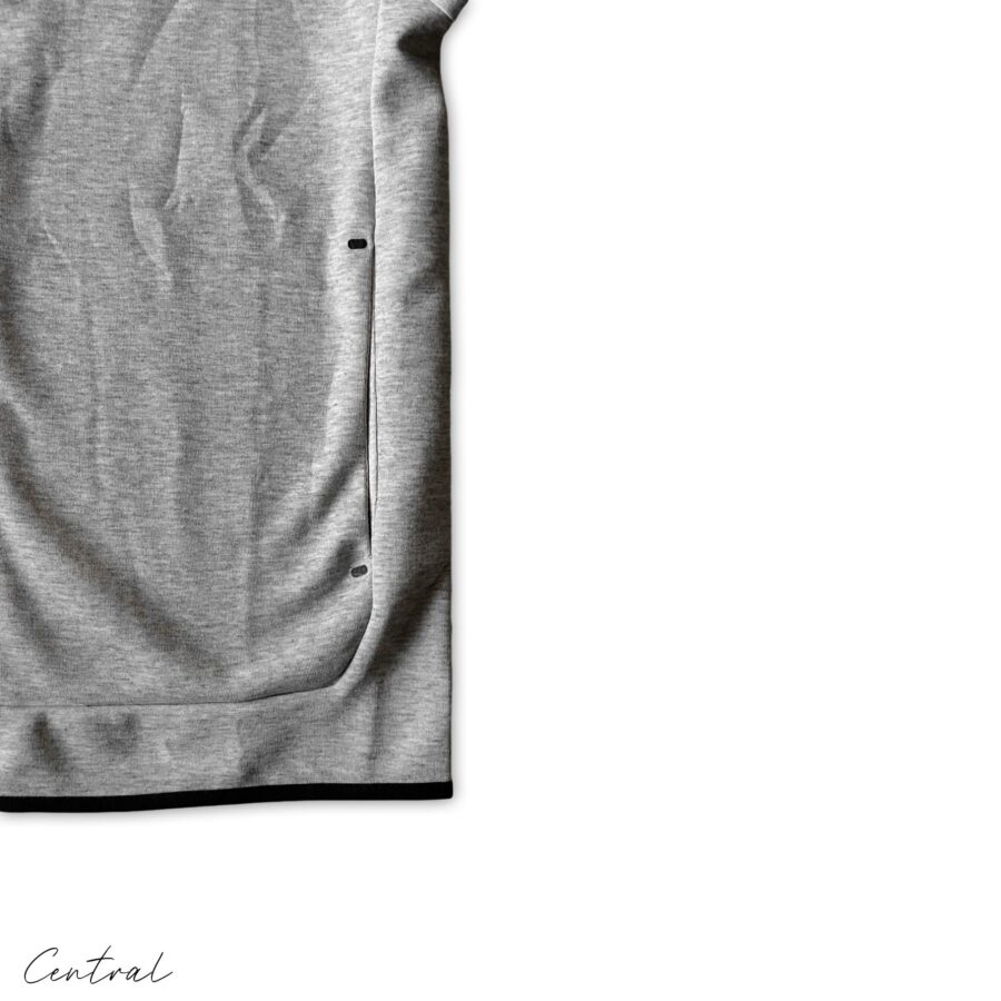 Nike Tech Fleece grey and black tracksuit set featuring a hoodie and pants, showcasing a stylish athletic look.