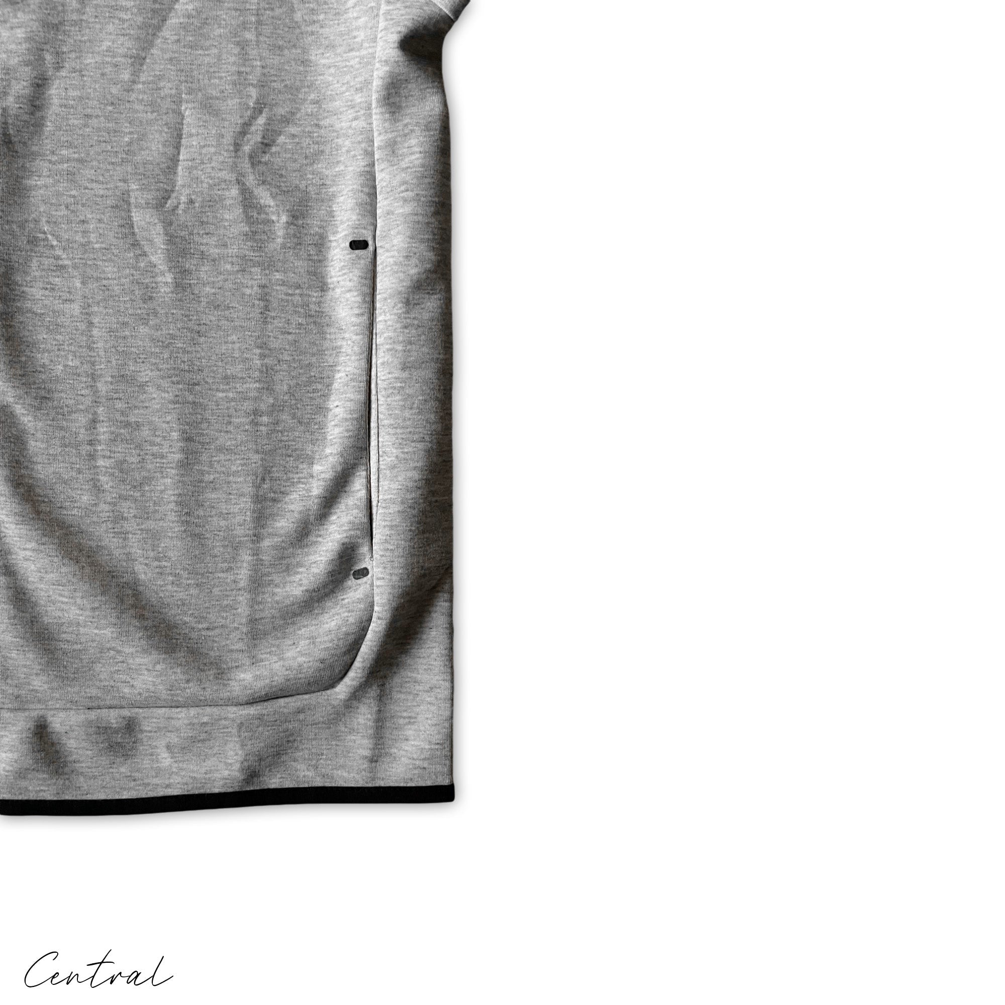 Nike Tech Fleece grey and black tracksuit set featuring a hoodie and pants, showcasing a stylish athletic look.