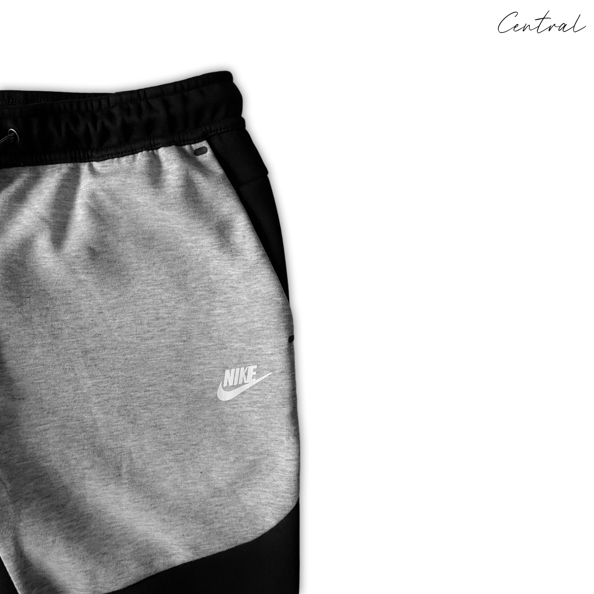 Grey and black Nike Tech Fleece tracksuit set featuring a hoodie and pants, ideal for casual wear and comfort.