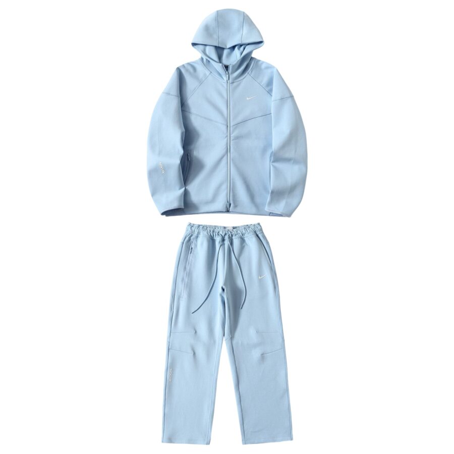Central ae NOCTA Tech Fleece hoodie and pants set in a cozy, stylish design, showcasing fabric texture and fit.