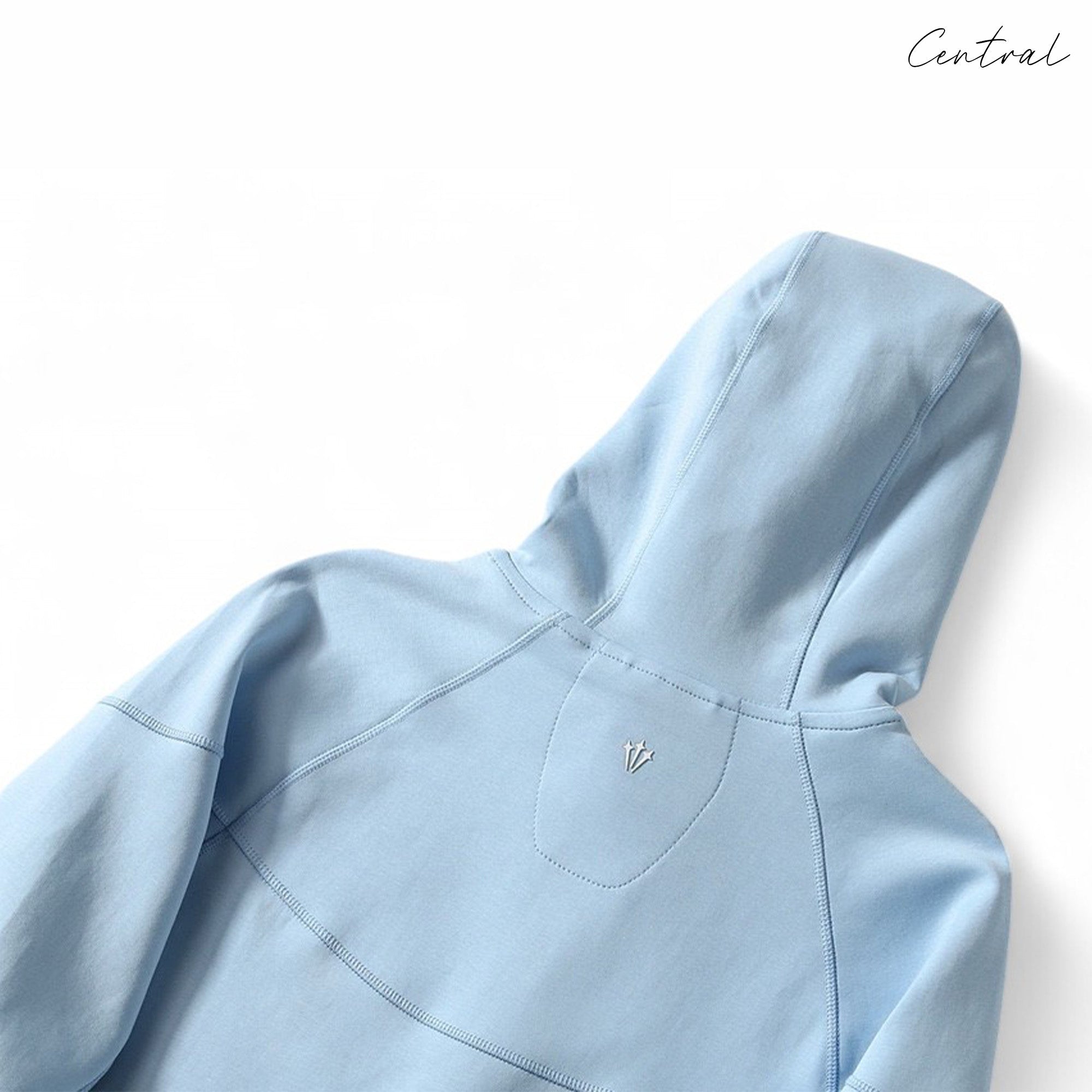 Central ae NOCTA Tech Fleece hoodie and pants set in a cozy, casual style, featuring a soft fabric texture.