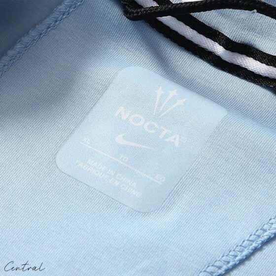 NOCTA Tech Fleece hoodie and pants set by Central ae, featuring a stylish design and comfortable fit in a casual setting.