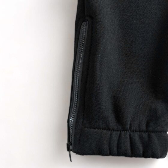 Trapstar black and red chenille decoded tracksuit set featuring a hoodie and pants displayed on a neutral background.