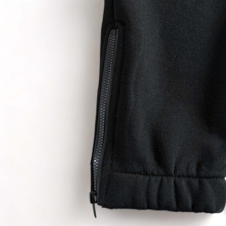 Trapstar black and red chenille decoded tracksuit set featuring a hoodie and pants displayed on a neutral background.