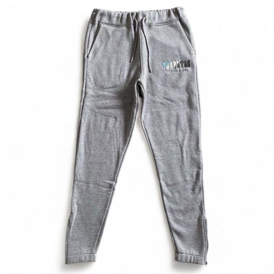 Trapstar Chenille Decoded tracksuit in grey, featuring a hoodie and pants set, displayed on a neutral background.