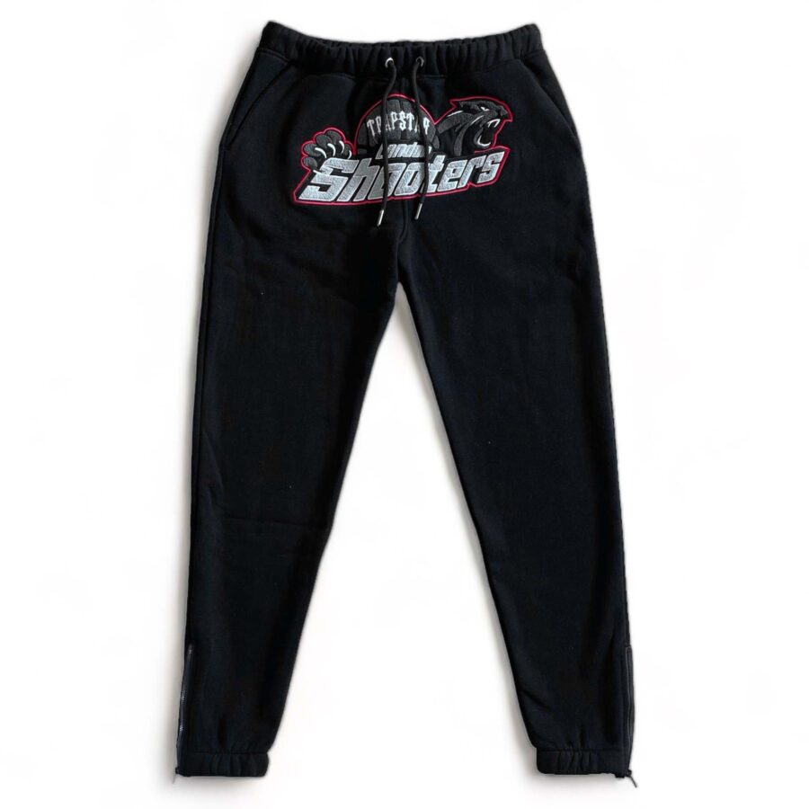 Trapstar Shooters tracksuit in black and red featuring a hoodie and matching pants set displayed on a neutral background.