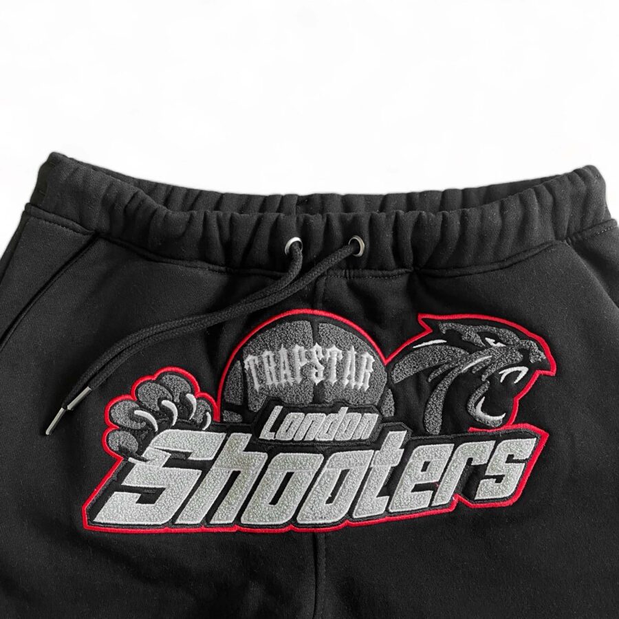 Trapstar Shooters black-red tracksuit set featuring a hoodie and pants, designed for a stylish, sporty look.