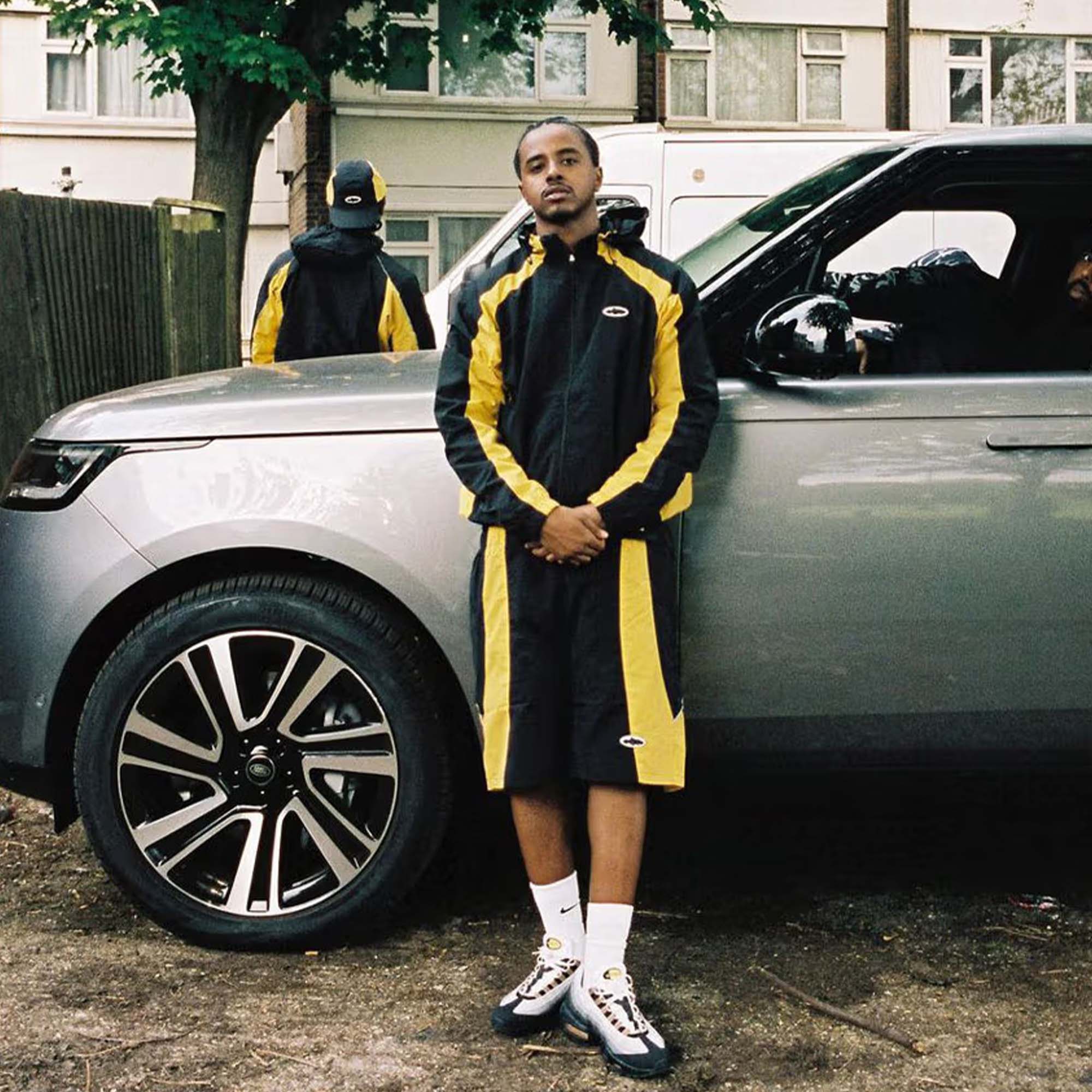 Black and yellow Corteiz hoodie from Central ae, featuring a comfortable fit and stylish design.