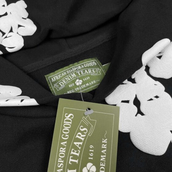 Black hoodie from Central AE featuring a cotton wreath design, showcasing a relaxed fit and casual style.
