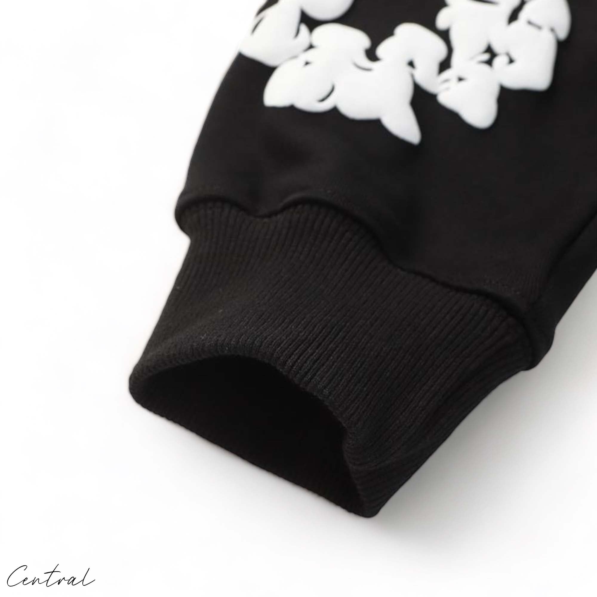 Black hoodie featuring a cotton wreath design by Denim Tears and Central AE.