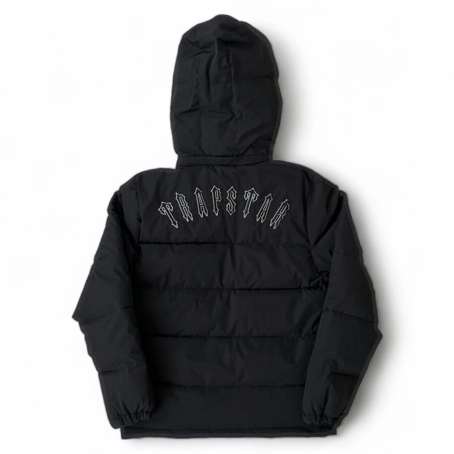 Trapstar Irongate black detachable hooded puffer jacket displayed with a sleek design and modern silhouette.