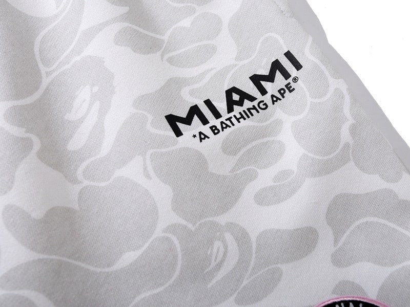 BAPE x Inter Miami white camo shorts featuring a stylish design and comfortable fit, displayed on a neutral background.