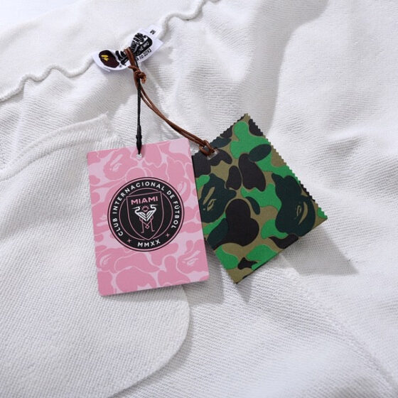 BAPE x Inter Miami white camo shorts featuring a unique pattern and comfortable fit by Central ae.