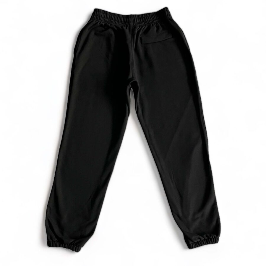 Corteiz Alcatraz black sweatpants featuring a relaxed fit and elastic waistband, perfect for casual wear.