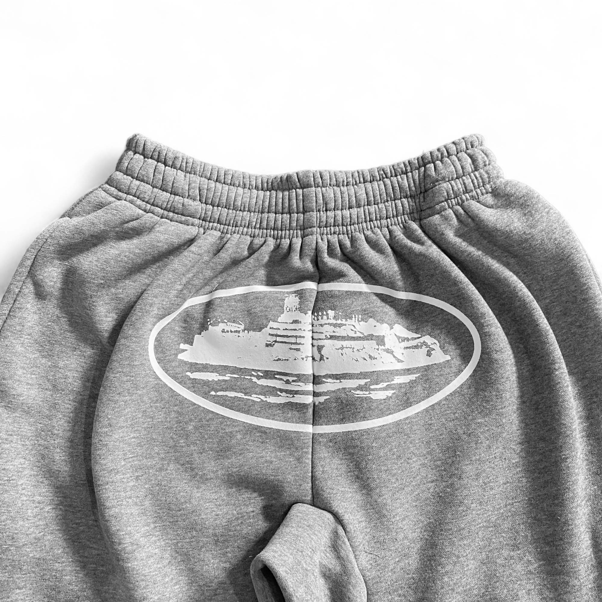 Gray Corteiz Alcatraz sweatpants featuring a relaxed fit and elastic waistband, ideal for casual wear.