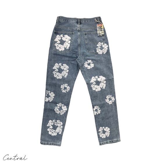 Light wash Denim Tears Levi's Cotton Wreath jeans featuring a relaxed fit and distinct denim texture from Central ae.