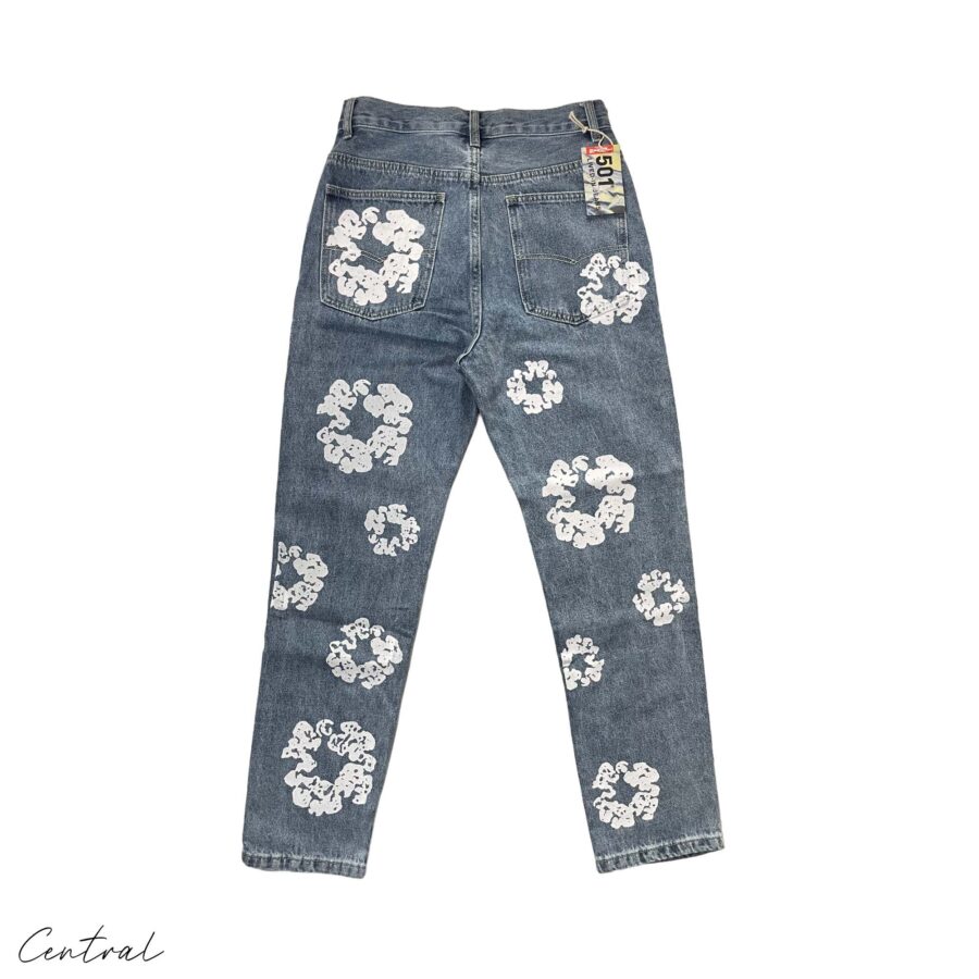 Light wash Denim Tears Levi's Cotton Wreath jeans featuring a relaxed fit and distinct denim texture from Central ae.